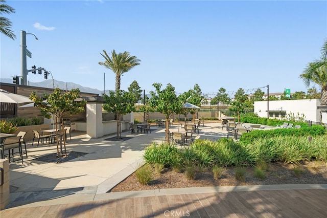 view of home's community with a patio and a mountain view