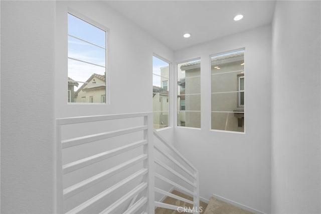 stairway featuring recessed lighting