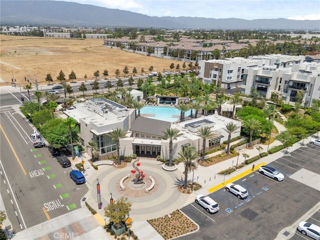 birds eye view of property featuring a mountain view