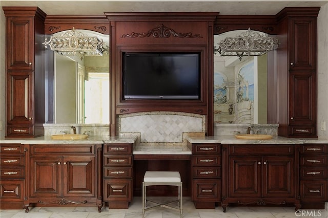 bathroom featuring vanity and decorative backsplash