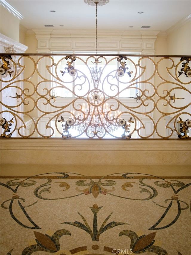 interior details with crown molding and an inviting chandelier