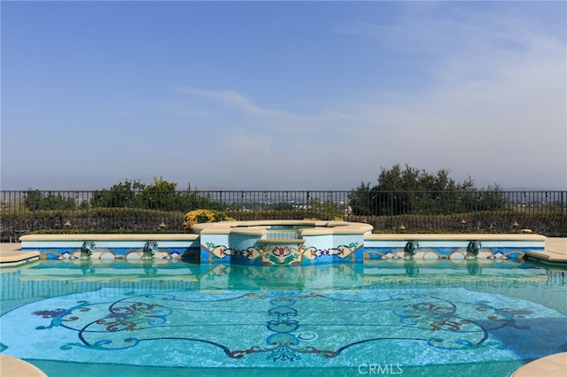 view of swimming pool featuring a fenced backyard, an outdoor hot tub, and a fenced in pool