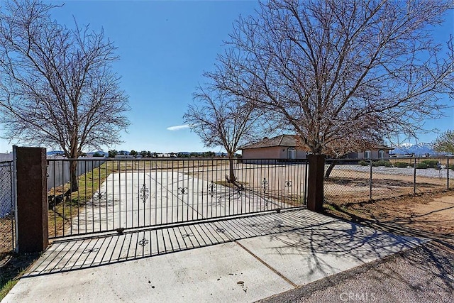 view of gate with fence