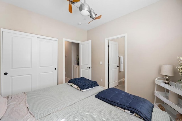 bedroom with a ceiling fan, baseboards, and a closet