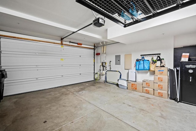 garage with electric panel and a garage door opener