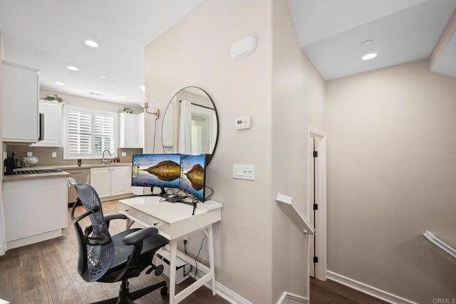 office area with a sink, baseboards, wood finished floors, and recessed lighting