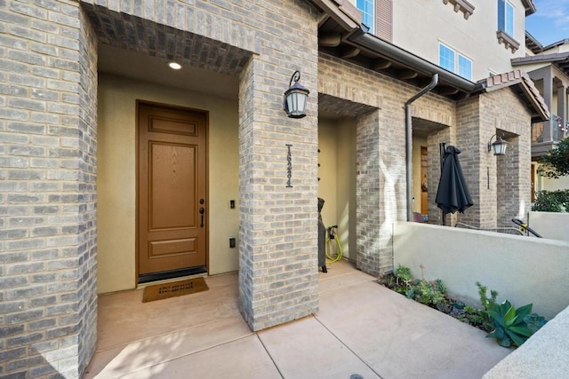 property entrance with brick siding