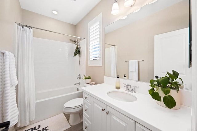 full bathroom with shower / tub combo, vanity, and toilet