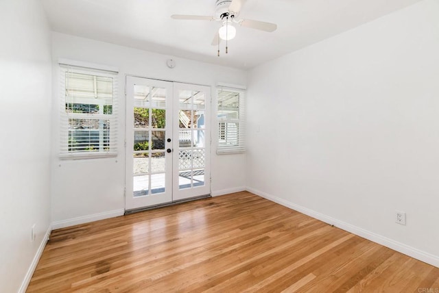 empty room featuring light wood-style floors, french doors, ceiling fan, and baseboards