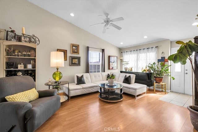 living area featuring lofted ceiling, ceiling fan, light wood finished floors, and recessed lighting