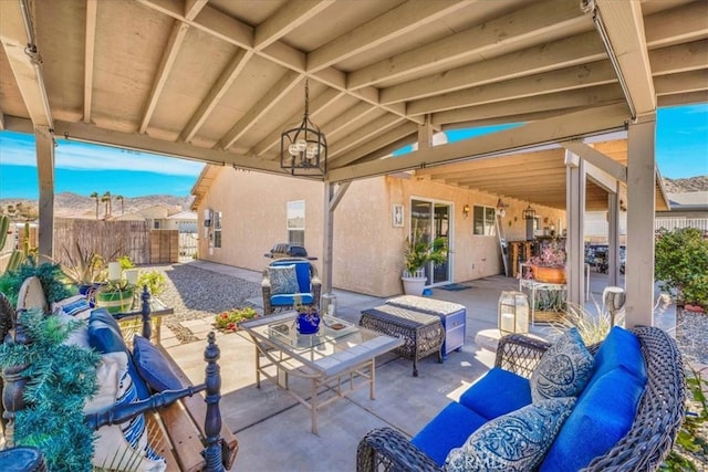 view of patio / terrace featuring fence and an outdoor living space