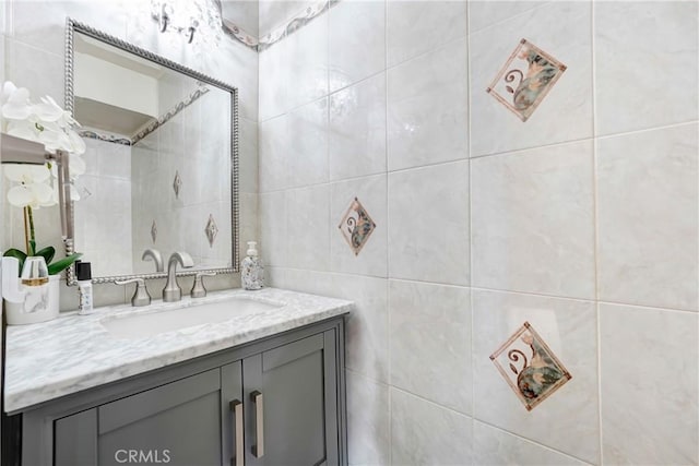 bathroom with tile walls and vanity