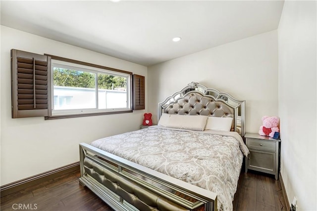 bedroom with dark wood-type flooring and recessed lighting