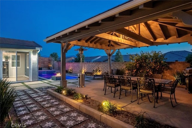 view of patio featuring a gazebo, outdoor dining space, a fenced backyard, and a fenced in pool