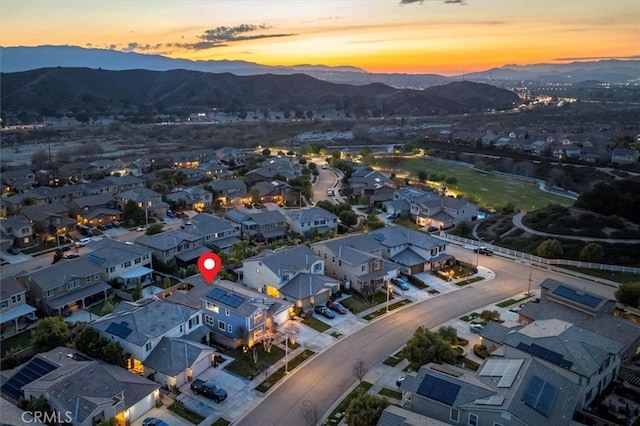 aerial view at dusk with a residential view and a mountain view