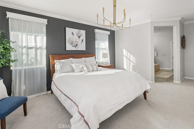 carpeted bedroom featuring a chandelier, ornamental molding, ensuite bathroom, and baseboards