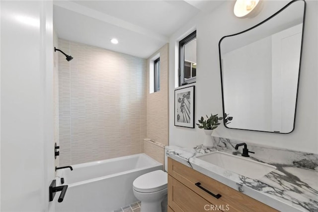 full bath with bathtub / shower combination, vanity, and toilet