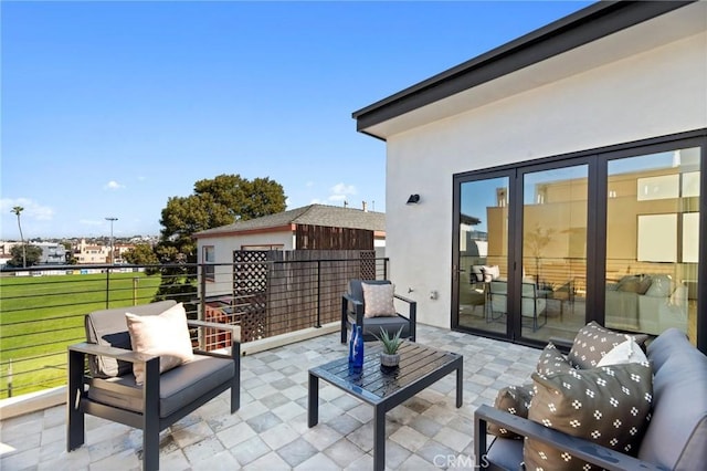 view of patio featuring a balcony