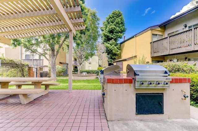 view of patio / terrace featuring a pergola and area for grilling
