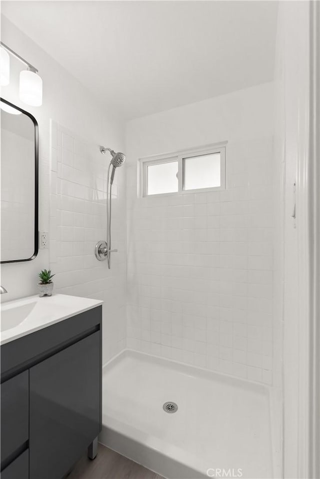 bathroom with vanity and a shower stall