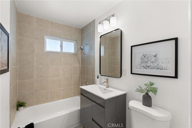 bathroom featuring vanity, toilet, and washtub / shower combination