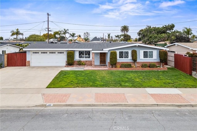 single story home featuring brick siding, fence, concrete driveway, and a front yard