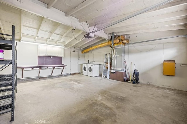 garage featuring separate washer and dryer and a garage door opener