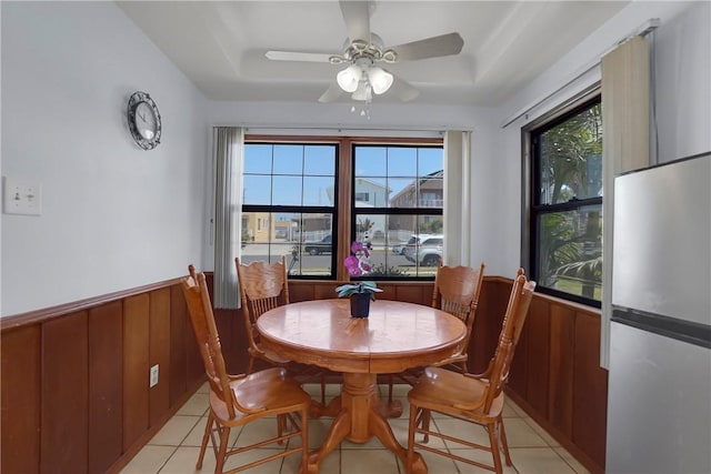 806 W 132nd St, Gardena, CA 90247 - dining space with wooden walls, a tray ceiling, and wainscoting