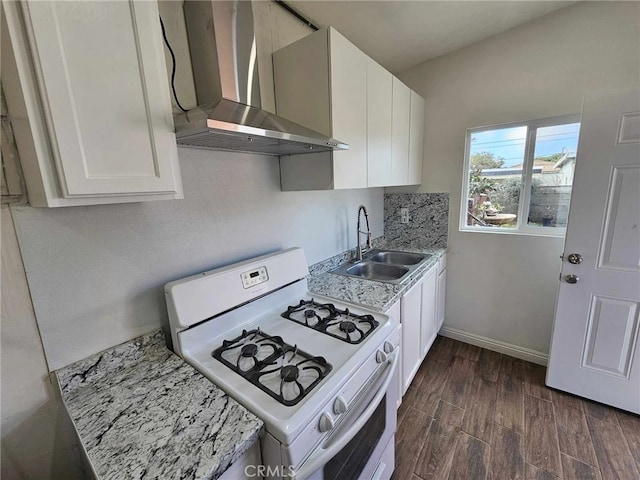 806 W 132nd St, Gardena, CA 90247 - kitchen featuring white range with gas cooktop, dark wood-style floors, wall chimney range hood, white cabinetry, and a sink