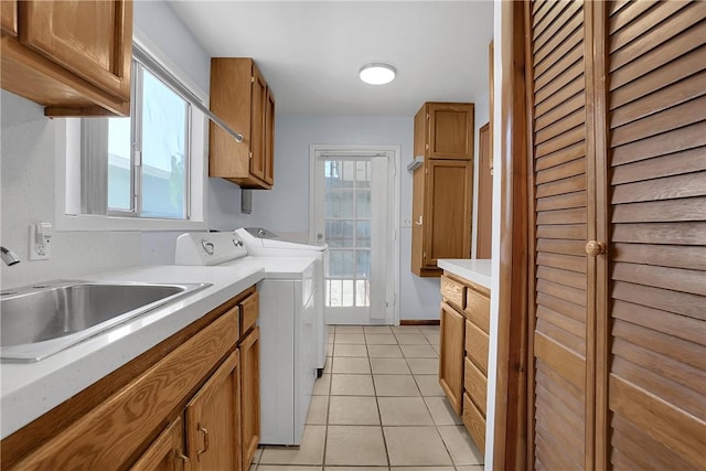 806 W 132nd St, Gardena, CA 90247 - clothes washing area featuring light tile patterned floors, separate washer and dryer, a sink, baseboards, and cabinet space