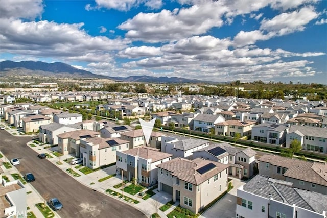 drone / aerial view with a mountain view and a residential view