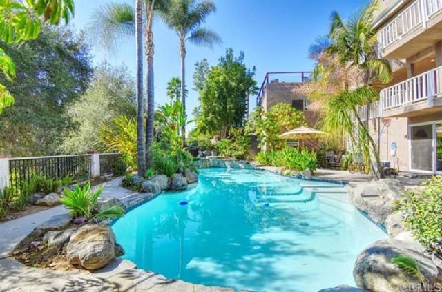 view of pool featuring a fenced in pool and fence