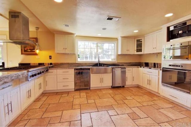 kitchen with recessed lighting, beverage cooler, island range hood, visible vents, and appliances with stainless steel finishes