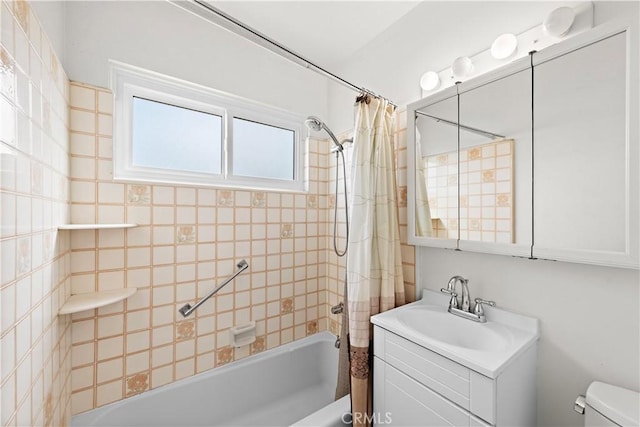 bathroom featuring toilet, shower / bath combo, and vanity