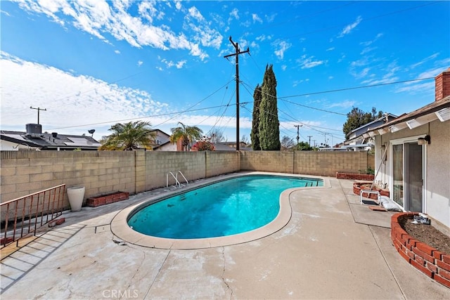 view of swimming pool featuring a patio area, a fenced backyard, and a fenced in pool