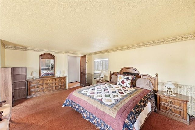 carpeted bedroom with crown molding and a textured ceiling