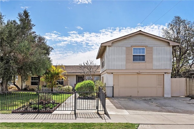 view of front of home with concrete driveway, an attached garage, fence, and stucco siding