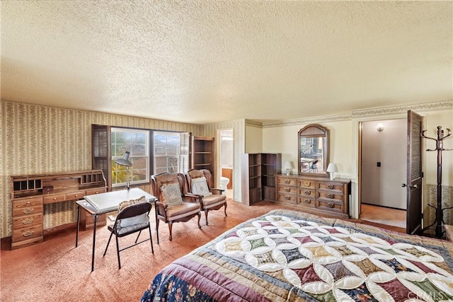 carpeted bedroom with a textured ceiling and wallpapered walls