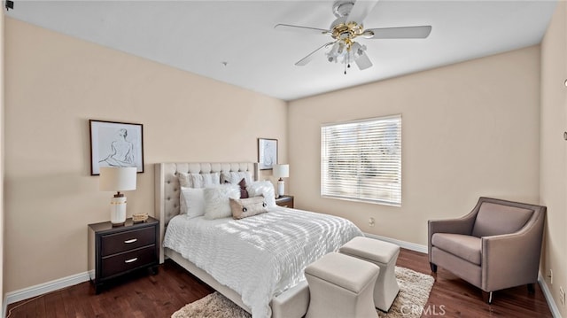 bedroom with a ceiling fan, dark wood-style flooring, and baseboards