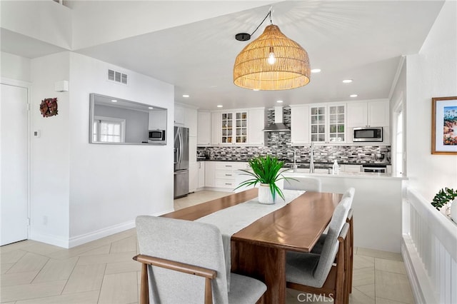 dining room with light tile patterned floors, baseboards, visible vents, and recessed lighting