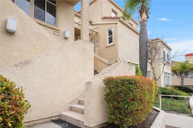 view of side of property featuring stucco siding