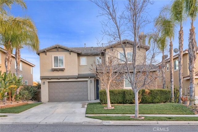 traditional home with driveway, a garage, a front lawn, and stucco siding