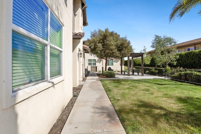 view of yard featuring fence and a patio