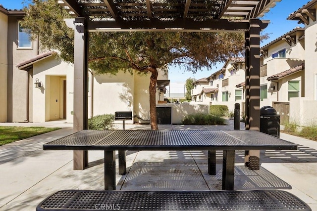 view of patio / terrace featuring fence, a grill, a residential view, and a pergola