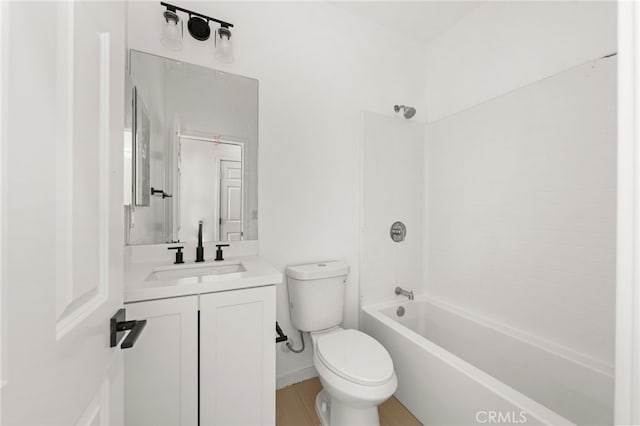 bathroom featuring toilet, vanity, and shower / bathing tub combination