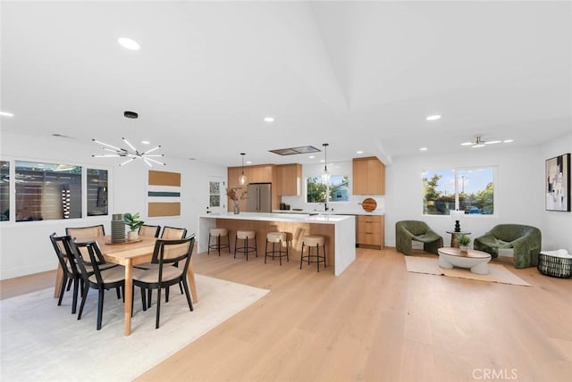 dining room featuring recessed lighting, a ceiling fan, and light wood-style floors