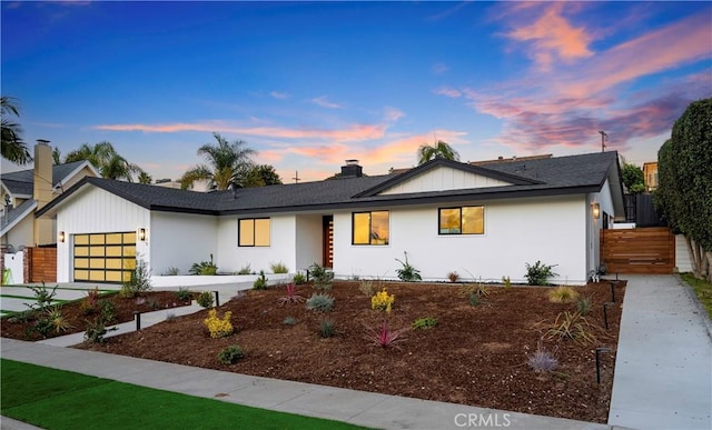 view of front of property featuring a garage and driveway