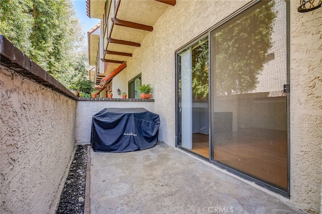 view of patio / terrace featuring fence and grilling area