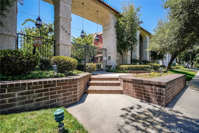 view of property's community with a gate