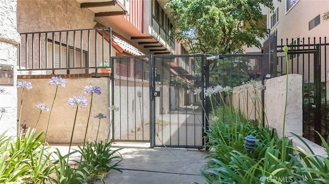 view of gate featuring fence